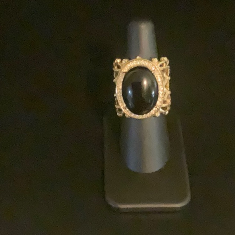 Large gold tone fashion ring with large black onyx and CZ diamonds. Sz 7